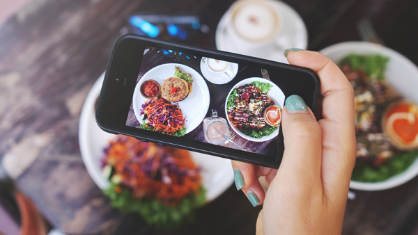 Restaurant food framed in a smart phone